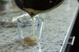 Pouring out oil and butter from a pan