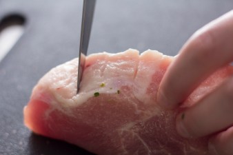 slicing the pork fat